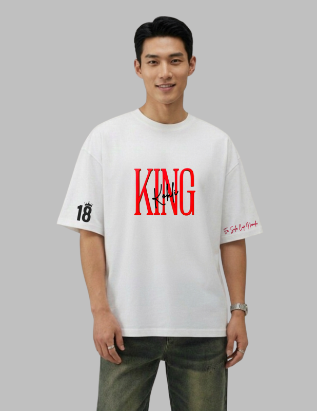 Man wearing a white t-shirt with red and black text on a gray background