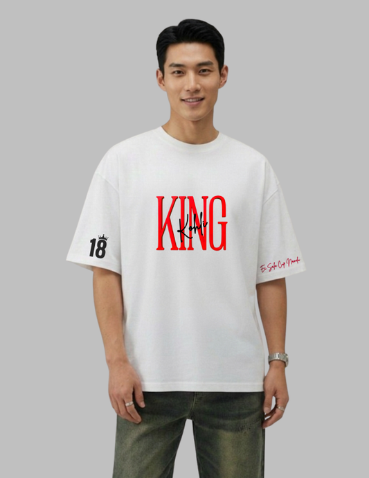 Man wearing a white t-shirt with red and black text on a gray background
