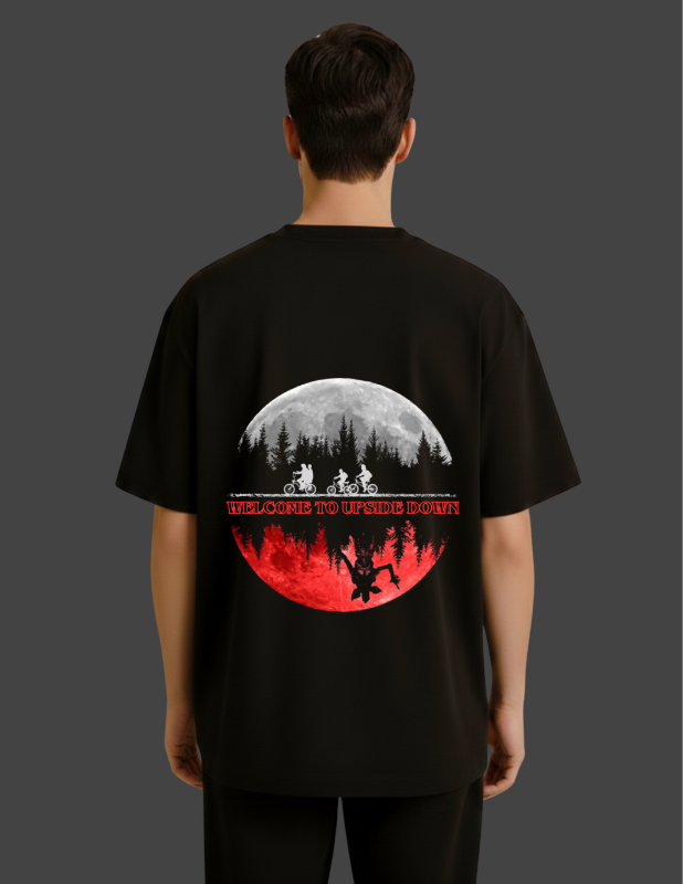 Black t-shirt with a graphic design on the back, featuring a moon and silhouette of people.