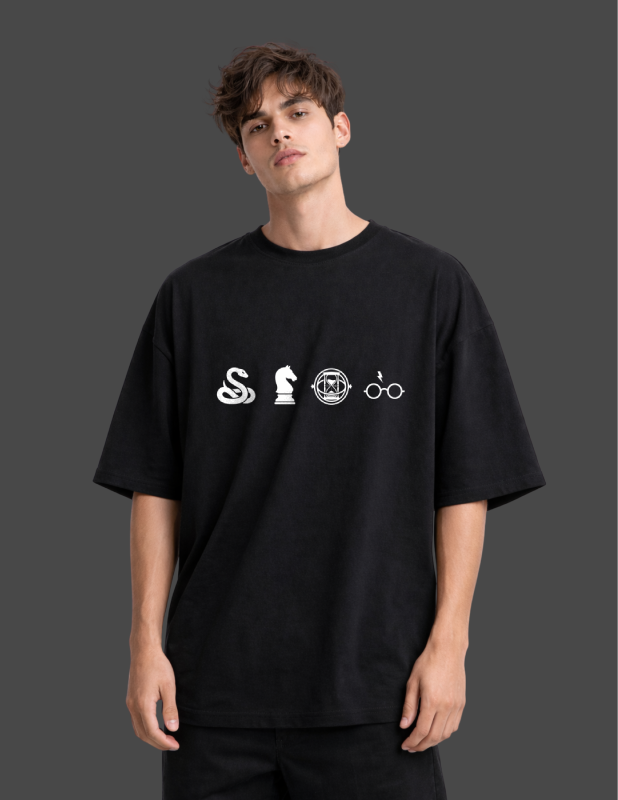Person wearing a black t-shirt with white symbols on a dark background