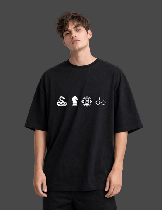 Person wearing a black t-shirt with white symbols on a dark background