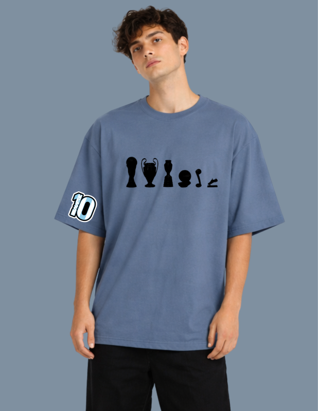 Person wearing a blue t-shirt with black graphics and numbers on a gray background