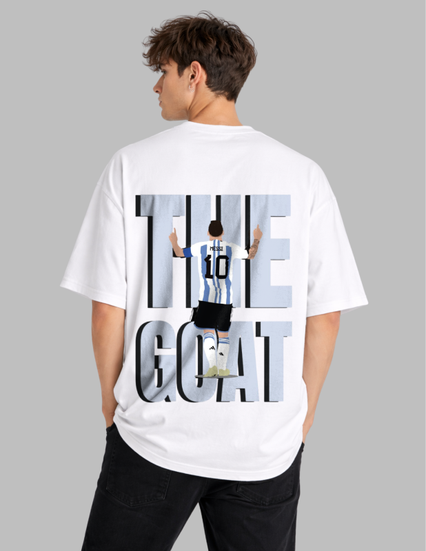 Person wearing a white t-shirt with 'The GOAT' graphic on the back, standing against a gray background.