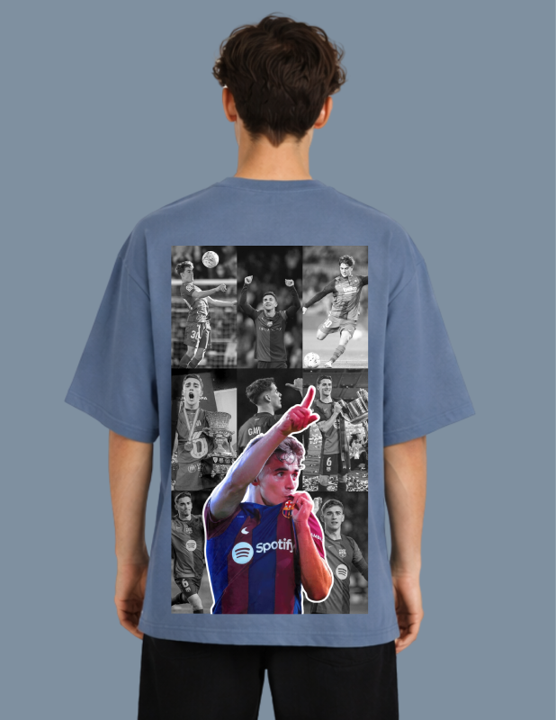 Person wearing a blue t-shirt with a collage of images on the back, set against a gray background.