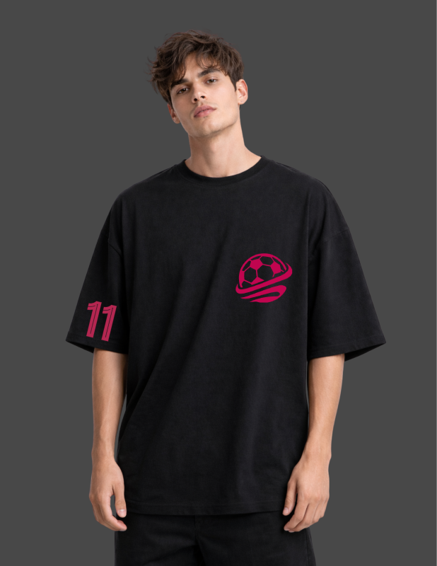 Person wearing a black t-shirt with a red logo and number on a dark background