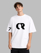 Person wearing a white t-shirt with a black logo on a gray background