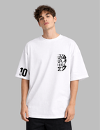 Person wearing a white t-shirt with black graphics and text on a gray background