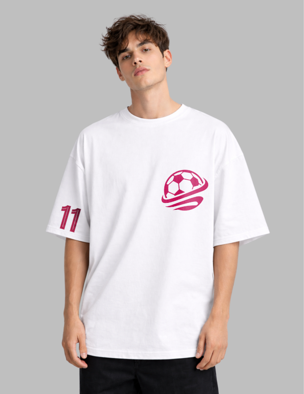 Person wearing a white t-shirt with pink graphics on a gray background