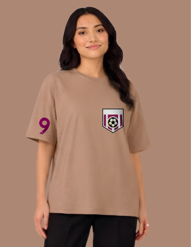 Woman wearing a beige t-shirt with a logo and number on a brown background