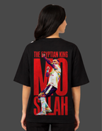 Person wearing a black t-shirt with 'The Egyptian King Mo Salah' design on the back.