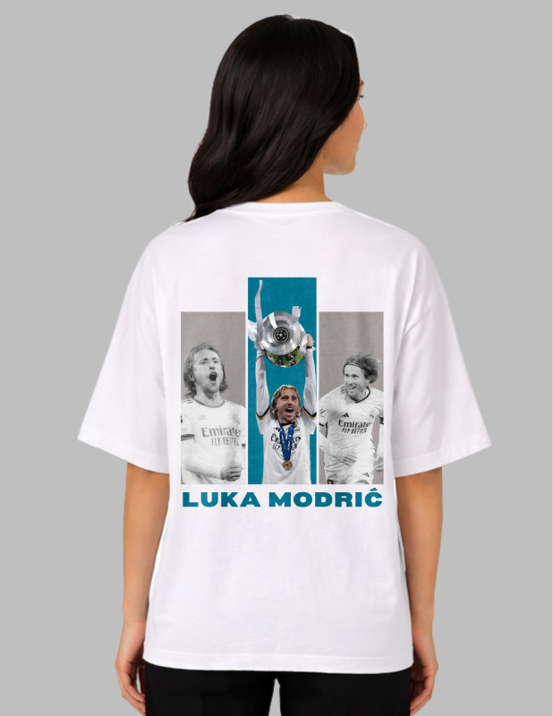 Person wearing a white t-shirt with images and text on the back, on a gray background