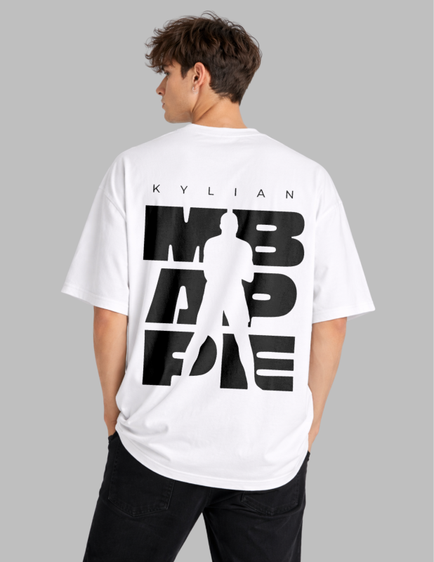 Person wearing a white t-shirt with black text and graphics on the back, standing against a gray background.