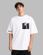 Person wearing a white t-shirt with a graphic design on a gray background