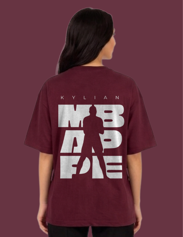 Person wearing a maroon t-shirt with white text and silhouette on a dark red background