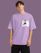 Person wearing a purple t-shirt with a graphic design on a purple background