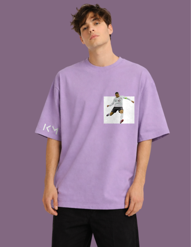 Person wearing a purple t-shirt with a graphic design on a purple background