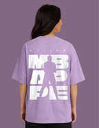 Person wearing a purple t-shirt with white text and silhouette on a purple background