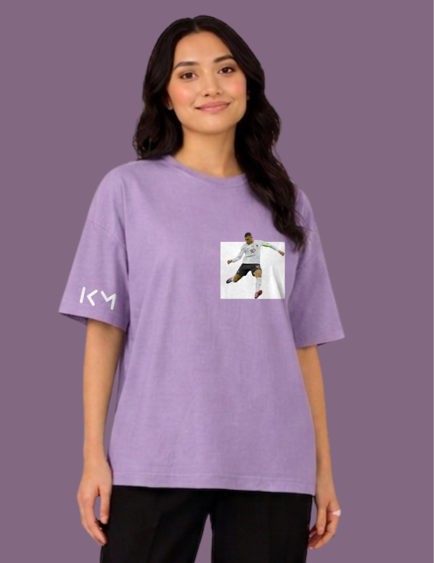 Person wearing a purple t-shirt with a graphic design on a purple background