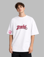 Person wearing a white t-shirt with red text and graphics on a gray background