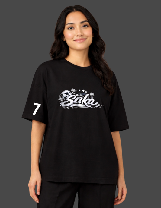 Person wearing a black t-shirt with 'Saka' logo and number '7' on a dark background
