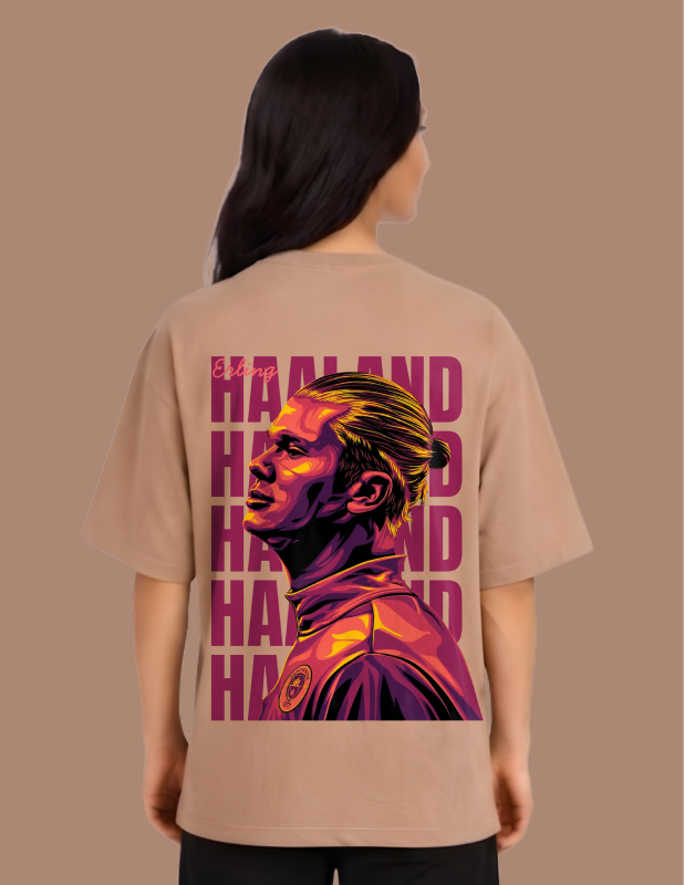 Person wearing a beige t-shirt with a graphic design on the back against a brown background