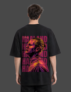 Person wearing a black t-shirt with a colorful graphic and text on the back.