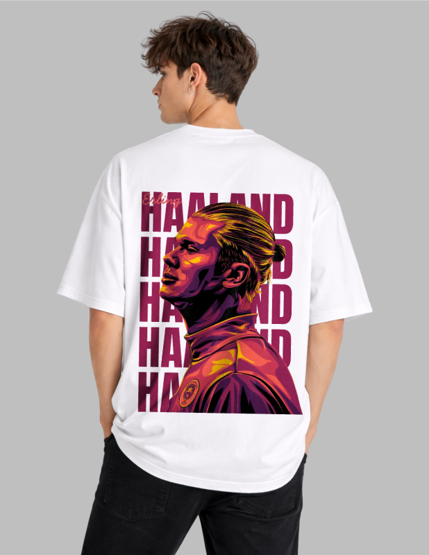Person wearing a white t-shirt with a colorful graphic and 'HAAAND' text on the back, against a gray background.