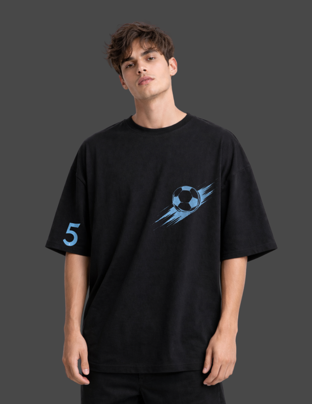 Person wearing a black t-shirt with a blue graphic design on a dark background