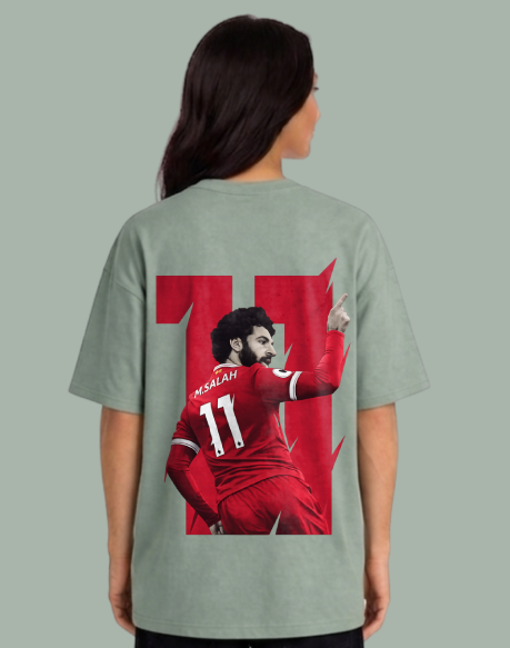 Person wearing a t-shirt with a graphic of a soccer player in red and the number 11 on a gray background