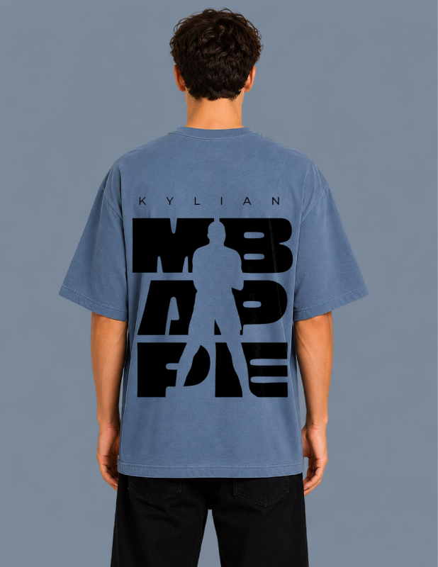 Person wearing a blue t-shirt with black text and silhouette on the back against a gray background
