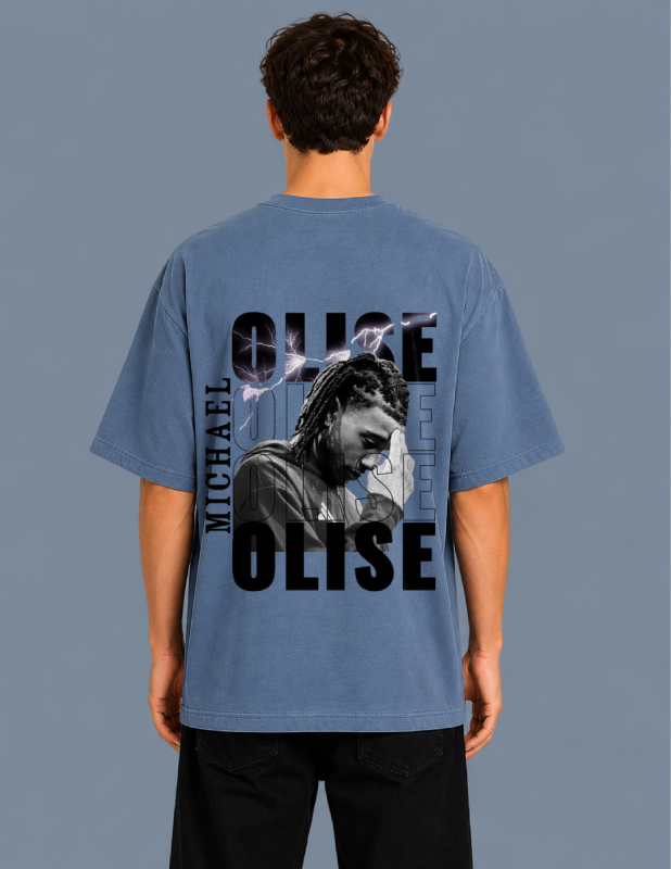 Person wearing a blue t-shirt with 'OLISE' and a graphic of a person on the back against a gray background