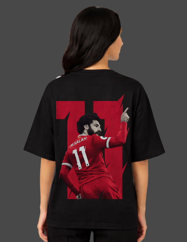 Person wearing a black t-shirt with a red graphic of a soccer player and the number 11 on the back.
