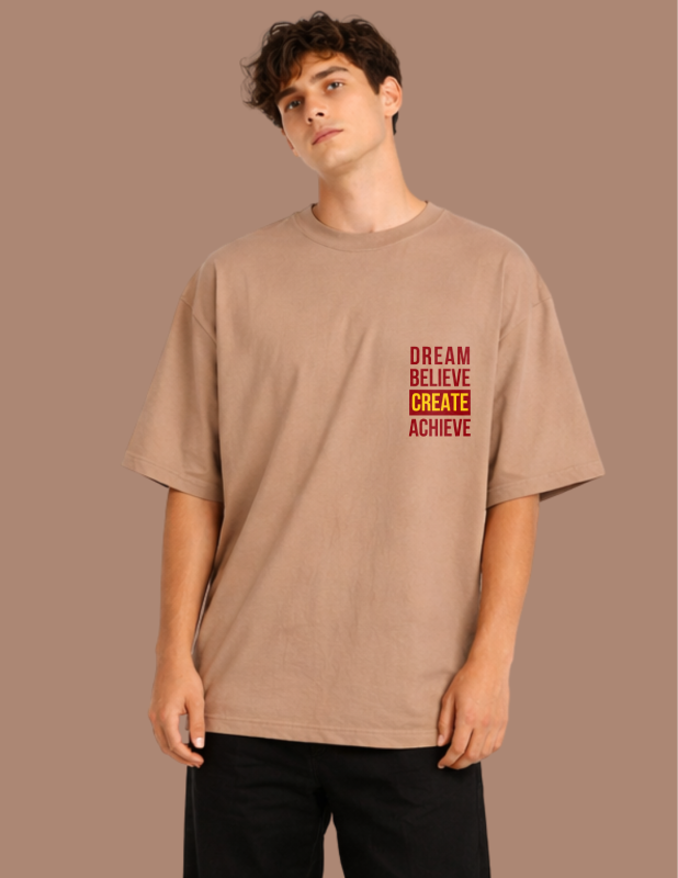 Person wearing a beige t-shirt with motivational text on a brown background