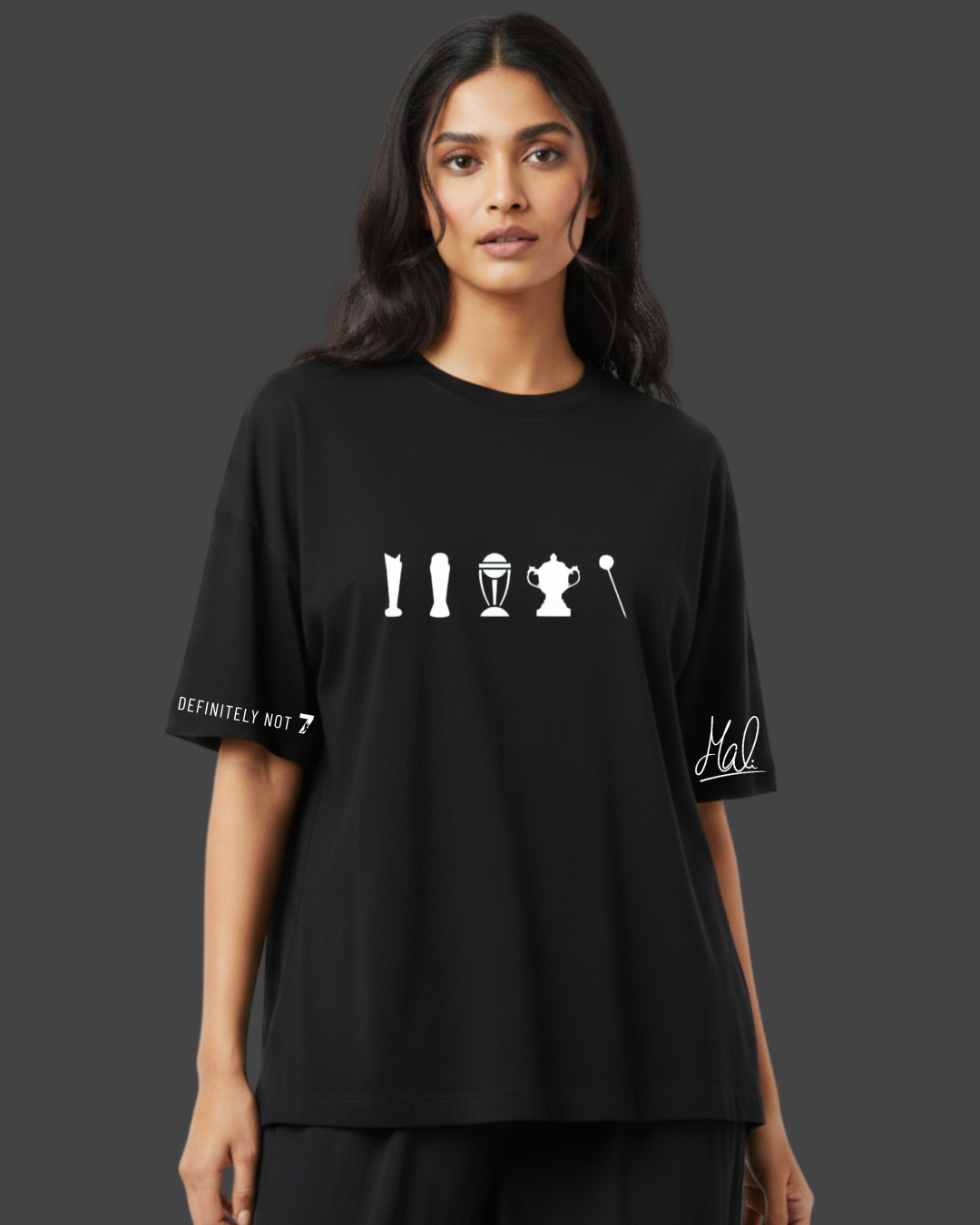 Person wearing a black t-shirt with white graphics and text on a dark background