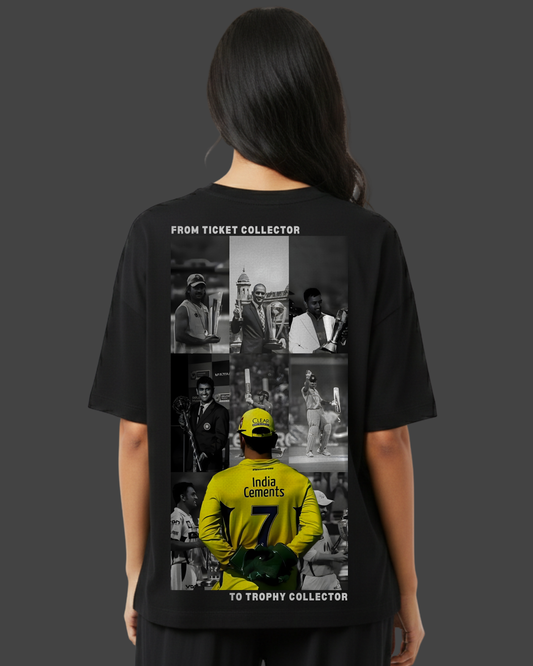 Person wearing a black t-shirt with a collage of images on the back, set against a dark background.