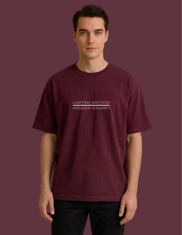 Man wearing a maroon t-shirt against a matching background