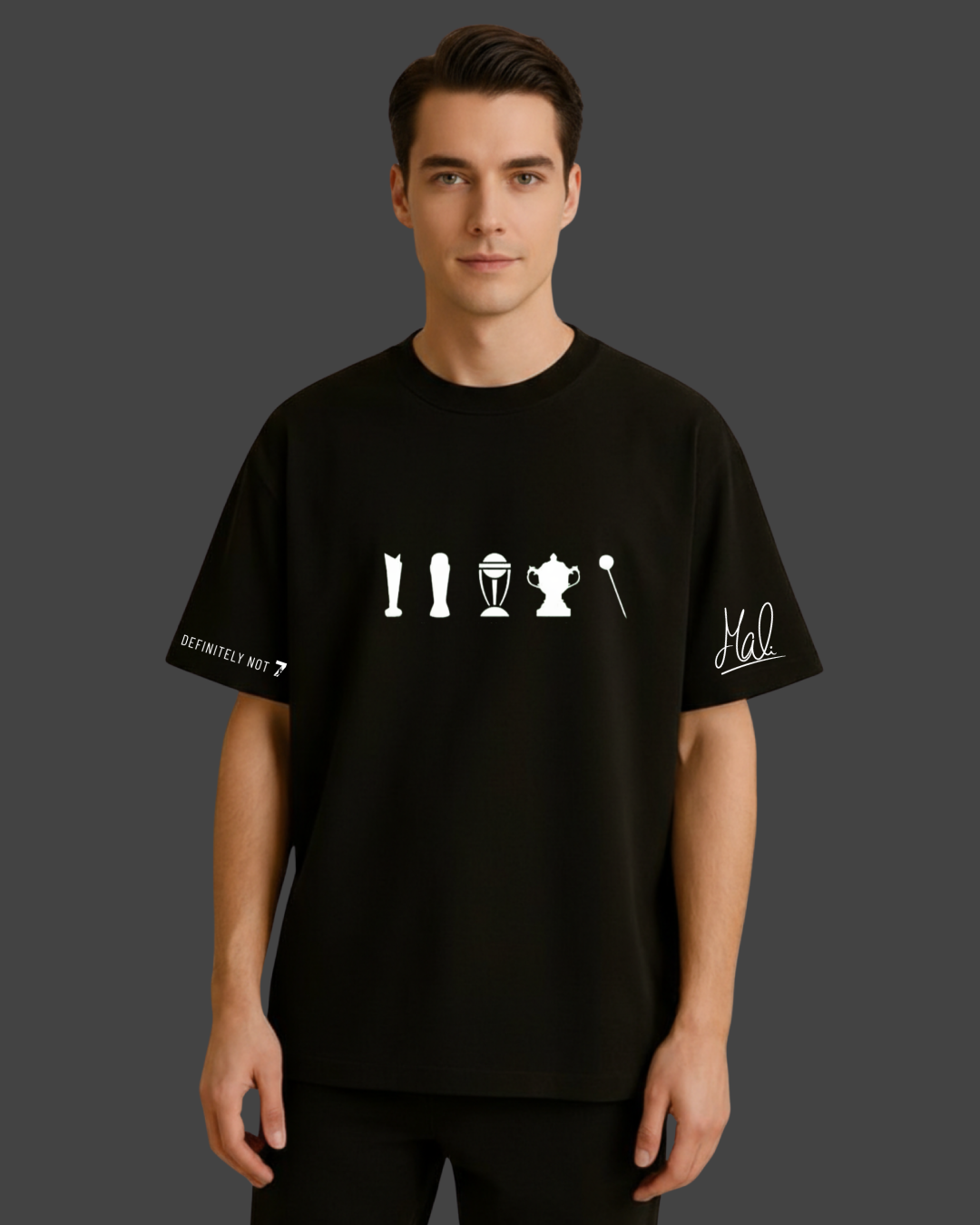 Man wearing a black t-shirt with white graphics and text on a dark background