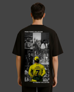Black t-shirt with a collage of images and text on the back, worn by a person.