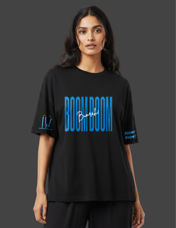 Woman wearing a black t-shirt with 'BOOM BOOM' text on a dark background