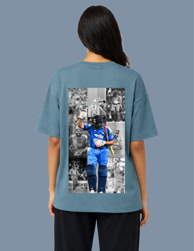 Person wearing a teal t-shirt with a graphic of a cricket player on the back against a gray background