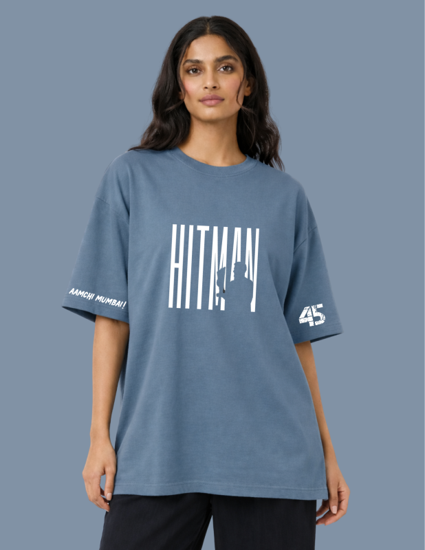 Woman wearing a blue t-shirt with 'HITMAN' and '45' branding on a gray background