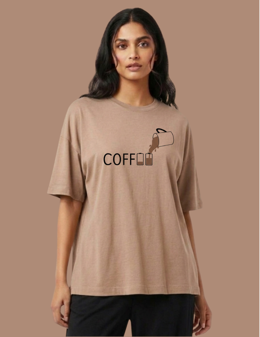 Woman wearing a beige t-shirt with 'COFFEE' graphic on a brown background