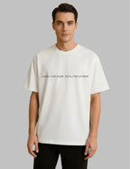 Man wearing a plain white t-shirt against a gray background