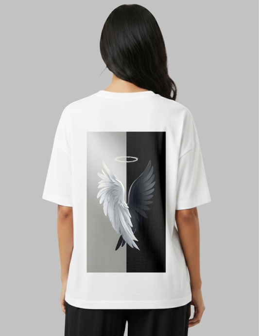 Person wearing a white t-shirt with a graphic design on the back featuring wings and a halo.