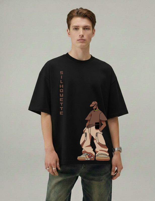Person wearing a black t-shirt with a graphic design on a plain background