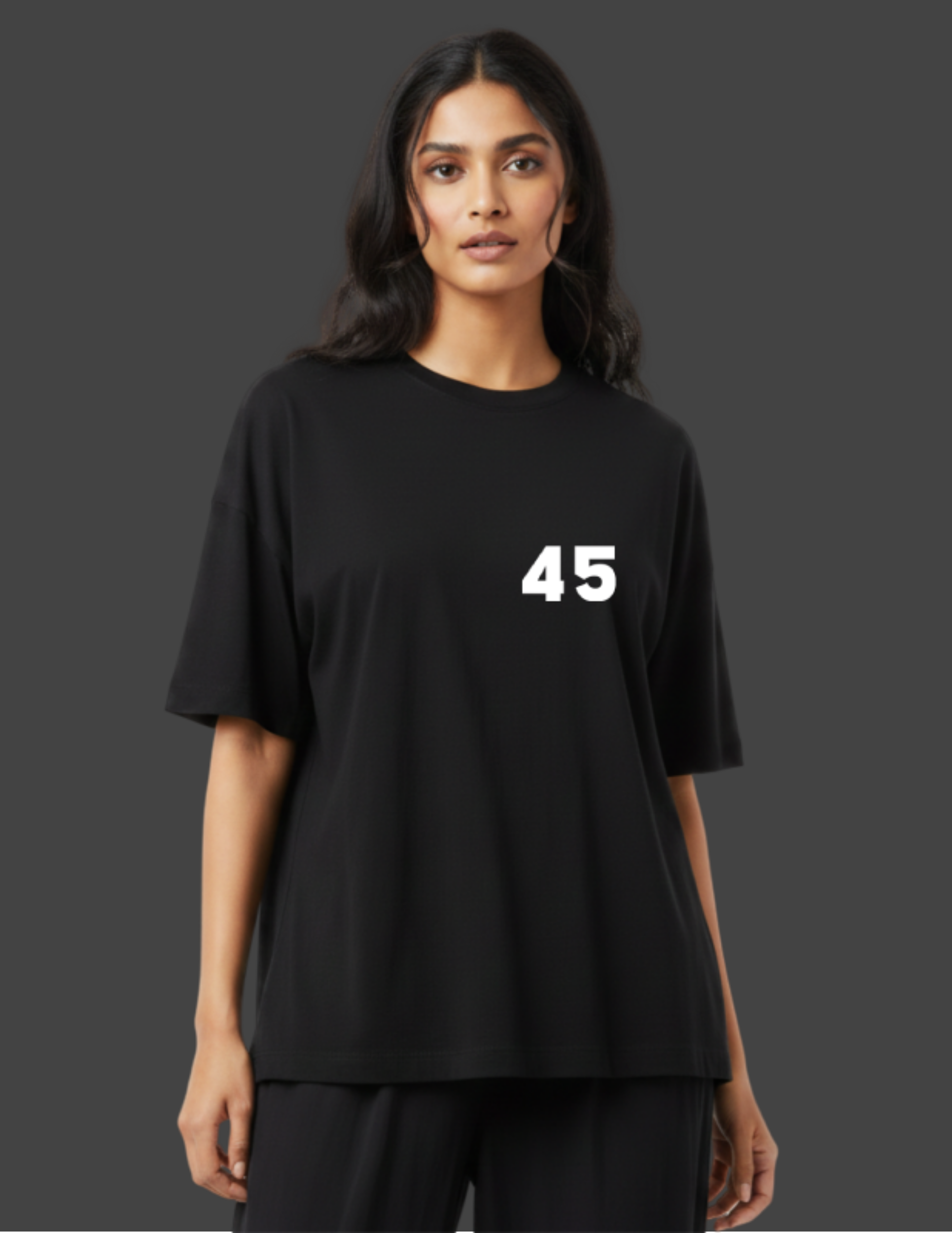 Person wearing a black t-shirt with the number 45 on a dark background